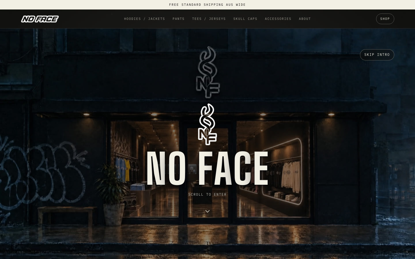 The NO FACE homepage: a dark, rain-soaked streetwear shopfront at night with the NO FACE logo over it